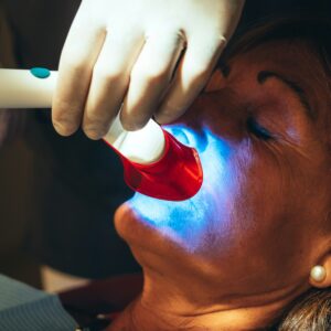 Caucasian Patient Goes To Dentist's Office For Teeth Whitening